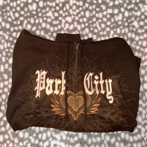Brown zip up jacket with park city design and heart designed hood